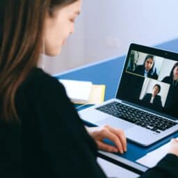 Woman using her laptop for a video meeting at work.