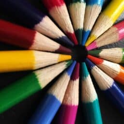 Back-to-school colored pencils arranged in a circle.