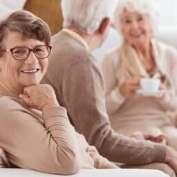 Smiling woman in the company of friends