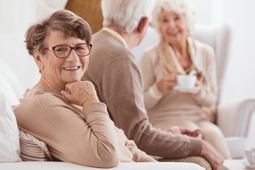 Smiling woman in the company of friends
